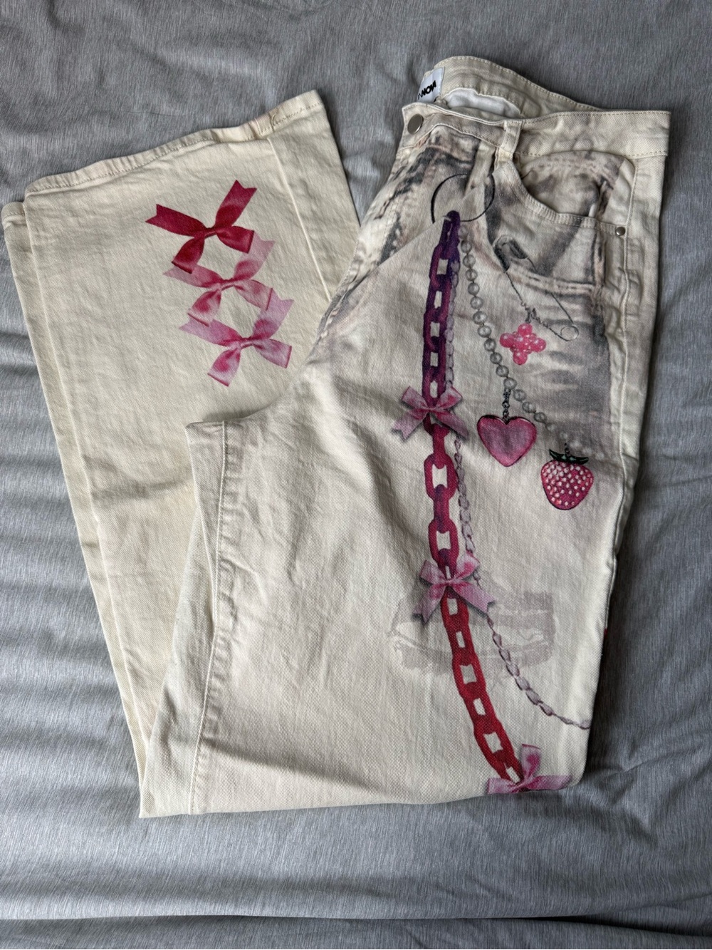 Women’s FashionNova Cream Jeans with Pink Chain & Charm Print